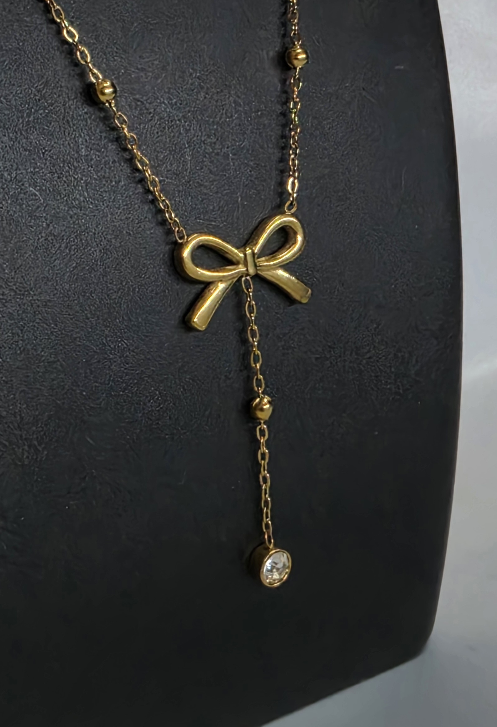 Gold Bow Drop Necklace — view 3